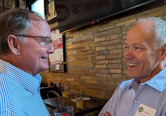 2 men talking