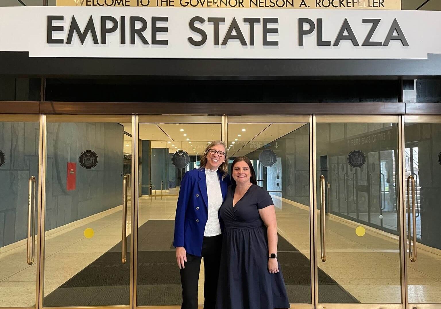 2 women in front of the Empire State Plaza